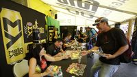 Fans get autographs from drivers and riders during Saturday's qualifying action at the NHRA Carolina Nationals at zMAX Dragway.