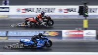 Pro Stock Motorcycle riders launch off the start line during Saturday's qualifying action at the NHRA Carolina Nationals at zMAX Dragway.