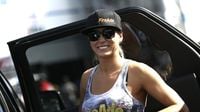 Top Fuel driver Leah Pritchett was all smiles before a qualifying run during Saturday's qualifying action at the NHRA Carolina Nationals at zMAX Dragway.