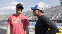 NASCAR superstar Dale Earnhardt Jr. talks to NHRA Funny Car points leader Ron Capps during opening-day qualifying at the NHRA Carolina Nationals at zMAX Dragway.