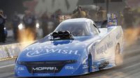 Tommy Johnson Jr. laid down a track record 3.876-second pass during opening-day qualifying at the NHRA Carolina Nationals at zMAX Dragway.