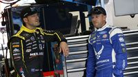 Paul Menard and Regan Smith chat in the garage before qualifying during Thursday's LiftMaster Pole Night at Charlotte Motor Speedway. 