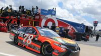 Defending Coca-Cola 600 champion Martin Truex Jr. pulls onto the track during Thursday's LiftMaster Pole Night at Charlotte Motor Speedway. 