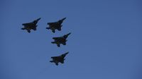 Four F-16 fighter jets fly over the speedway during Sunday's running of the Coca-Cola 600 at Charlotte Motor Speedway.