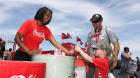Fans sample Coca-Cola products in the Fan Zone before Sunday's running of the Coca-Cola 600 at Charlotte Motor Speedway.