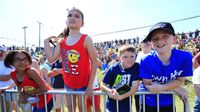 Young fans line the fence looking for autographs and a good vantage point for watching the Fan Zone fun during Monster Energy All-Star Saturday at Charlotte Motor Speedway.