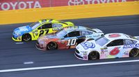 Racers Paul Menard, Danica Patrick and Trevor Bayne go three-wide racing for position in the Monster Open during Monster Energy All-Star Saturday at Charlotte Motor Speedway.