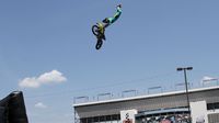 Motorcross riders put on a thrill show for fans in the Fan Zone during Friday's action at Charlotte Motor Speedway.