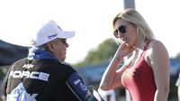Funny Car father-daughter duo John and Courtney Force talk in the staging lanes before qualifying during the opening day of the NHRA Carolina Nationals at zMAX Dragway.