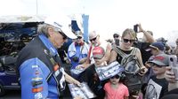 Sixteen-time NHRA Funny Car champion greets fans and signs autographs during an action-packed Saturday at the NHRA Carolina Nationals.