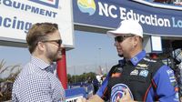 Speedway Motorsports CEO Marcus Smith talks to Funny Car driver Robert Hight before driver introductions during Sunday's eliminations at the NHRA Carolina Nationals. 