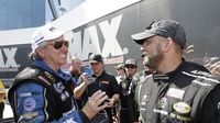 Sixteen-time Funny Car champion John Force and eight-time Top Fuel champion Tony Schumacher talk backstage during Sunday's eliminations at the NHRA Carolina Nationals. 