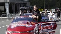 Pro Stock favorite Greg Anderson rides through the staging lanes before qualifying during the opening day of the NHRA Carolina Nationals at zMAX Dragway.