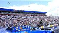 Tommy Johnson Jr. warms up his tires before a qualifying pass during the opening day of the NHRA Carolina Nationals at zMAX Dragway.