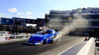 John Force warms up the tires on his Funny Car during an action-packed Saturday at the NHRA Carolina Nationals.