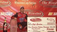 Jeff Gordon poses with the trophy and winner's check following his 2001 victory at The Winston (now the Sprint All-Star Race) at Charlotte Motor Speedway.