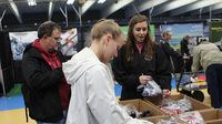 Visitors sort through offerings in the manufacturer's midway at the Pennzoil AutoFair presented by Advanced Auto Parts at Charlotte Motor Speedway.