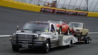 A tow truck brings cars into the infield as car enthusiasts set up during opening day of the Charlotte AutoFair at Charlotte Motor Speedway.