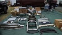 A variety of assorted classic car parts and pieces at a booth in the swap meet during opening day of the Charlotte AutoFair at Charlotte Motor Speedway.