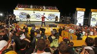 Andy Grammer performs before the start of driver introductions during an action-packed NASCAR Sprint All-Star Race at Charlotte Motor Speedway.