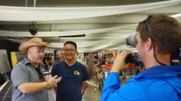 Speedway TV's Wilson interviews fans about AutoFair displays during Day 2 of the Charlotte AutoFair at Charlotte Motor Speedway.