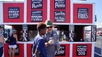 Speedway TV personality Wilson interviews fans about some of the AutoFair's fun foods during a busy Saturday at the Pennzoil AutoFair presented by Advance Auto Parts.