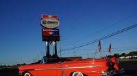 A classsic cruiser sits in front of the main entrance at Charlotte Motor Speedway during Saturday's fun at the Charlotte AutoFair at Charlotte Motor Speedway.