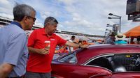 Charlotte Motor Speedway Executive Vice President Greg Walter (left) and NASCAR analyst and noted car enthusiast Mike Joy judge the Best of Show during Sunday's final day of the Pennzoil AutoFair presented by Advance Auto Parts.