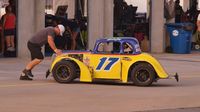 Scott Joy gets pushed out of the garage area before heat races for the Semi-Pros during Round 6 of the Bojangles' Summer Shootout at Charlotte Motor Speedway.