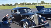 A car owner carefully details his classic ride on Thursday before the 22nd annual Goodguys Southeastern Nationals return to Charlotte Motor Speedway.