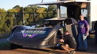 Crews work in the pits before a test session at The Dirt Track at Charlotte ahead of the Nov. 5-7 Bad Boy Buggies World of Outlaw World Finals.