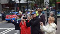 Fans lines the streets to snap photos during a Laps Around Uptown event in Center City Charlotte Monday to kick off race week at Charlotte Motor Speedway.