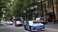 More than 15 stock cars and pace cars filled Center City Charlotte with the sights and sounds of NASCAR during a Laps Around Uptown event in Center City Charlotte Monday to kick off race week at Charlotte Motor Speedway.