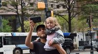 Fans were all smiles watching NASCAR stock cars drive through Center City Charlotte during a Laps Around Uptown event in Center City Charlotte Monday to kick off race week at Charlotte Motor Speedway.