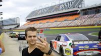 Hunter Hayes snaps photos along pit road before taking a Rusty Wallace Racing Experience ride along at Charlotte Motor Speedway on Friday, Aug. 7, 2015. Hayes was at the speedway to promote his upcoming concert before the Bank of America 500 on Saturday, Oct. 10, 2015.