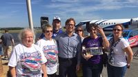 Charlotte Motor Speedway President and General Manager Marcus Smith poses for a photo with Greensboro fans during a three-city barnstorm tour to preview the Bank of America 500 and the NASCAR Chase for the Sprint Cup championship.