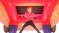 A young AutoFair visitor appears to be suspended in the air while jumping in a bounce house in the Atrium Health Play Zone during an action-packed Friday of fun at the Pennzoil AutoFair presented by Advance Auto Parts.