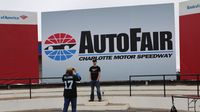 Fans snap photos in Victory Lane Sunday at AutoFair.
