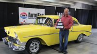 Tim Coley poses for a photo with his 1956 Chevrolet 210, which won Best of Show Sunday at AutoFair.