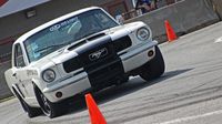 A vintage Mustang takes to the AutoCross course during the second day of the Goodguys Southeastern Nationals at Charlotte Motor Speedway.