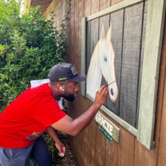 Charlotte Motor Speedway volunteers tackled a wide range of projects at Wings of Eagles, from touching up stable art to landscaping, building a fence and pressure washing during its fifth annual Day of Service.