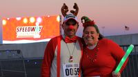 Festively dressed runners turned out by the thousands to take part in the fourth annual Egg Nog Jog 5K during opening night of Charlotte Motor Speedway's seventh annual Speedway Christmas.