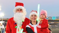 Festively dressed runners turned out by the thousands to take part in the fourth annual Egg Nog Jog 5K during opening night of Charlotte Motor Speedway's seventh annual Speedway Christmas.