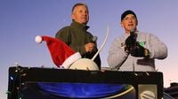 WJZY's Chuck Howard and Charlotte Motor Speedway's Lenny Batycki fire up the crowd of more than 1,700 runners on hand for the Egg Nog Jog 5K during opening night of Charlotte Motor Speedway's seventh annual Speedway Christmas.