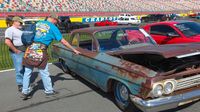 Visitors take in some of the more than 1,000 cars already on display early during opening day at the Pennzoil AutoFair at Charlotte Motor Speedway.
