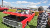 This flamed-out low-ride Chevy pickup truck turned heads during opening day at the Pennzoil AutoFair at Charlotte Motor Speedway.