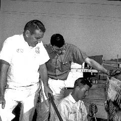 Marvin Panch (front), Leonard Wood (back) Glen Wood (kneeling). - World 600 - 1963 - CMS Archives