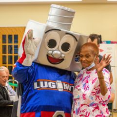 Charlotte Motor Speedway's mascot Lug Nut visits with residents at the Coltrane LIFE Center, Concord, during the speedway's fifth annual Day of Service.