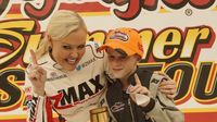 Tyler Chapman celebrates in victory lane with Miss zMAX during Round 8 of the Bojangles' Summer Shootout at Charlotte Motor Speedway.