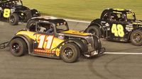 Dawson Cram (11) and Alex Reece (48)race side-by-side in the Legend Car Young Lions division during opening night of the Bojangles' Summer Shootout at Charlotte Motor Speedway.